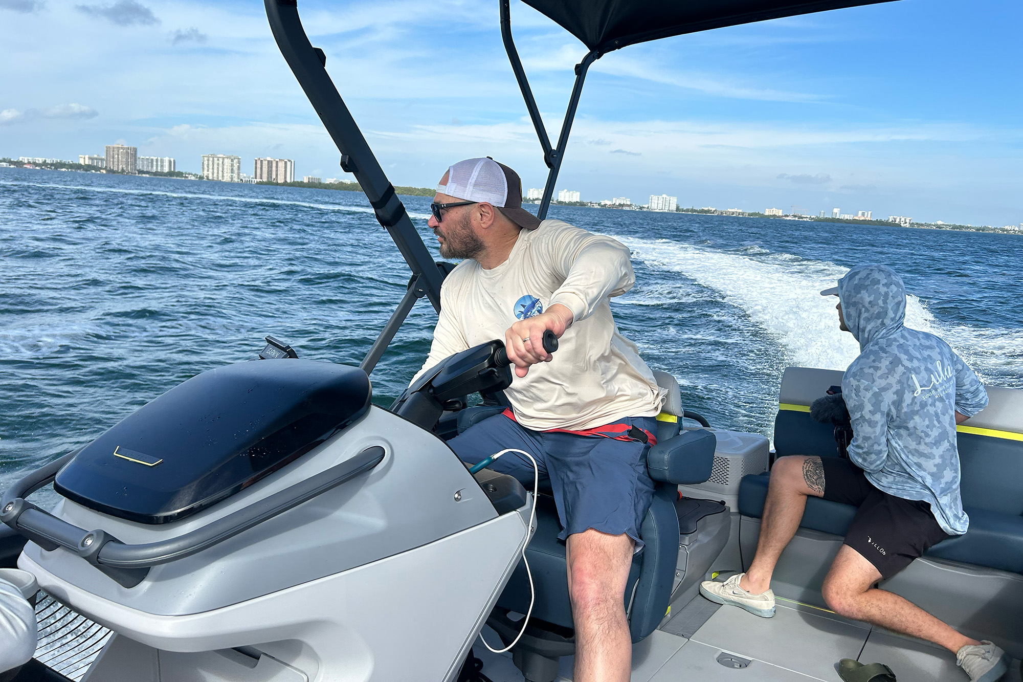 man driving sea doo switch pontoon