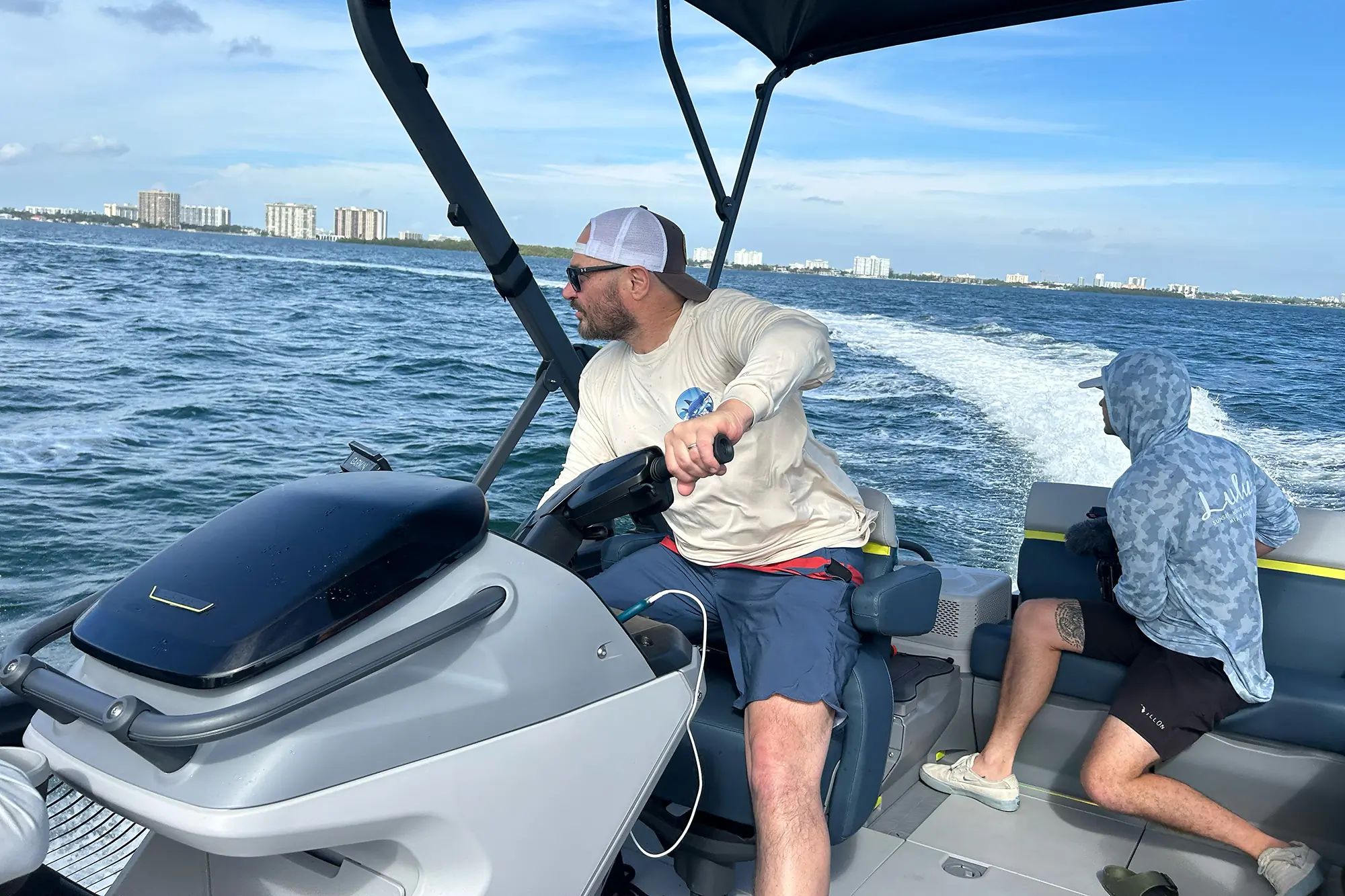 man driving sea doo switch pontoon