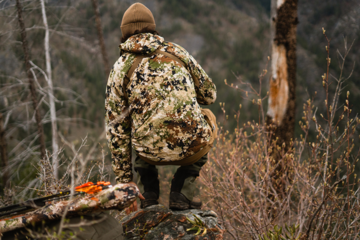 hunter wearing sitka ambient 100 hooded jacket