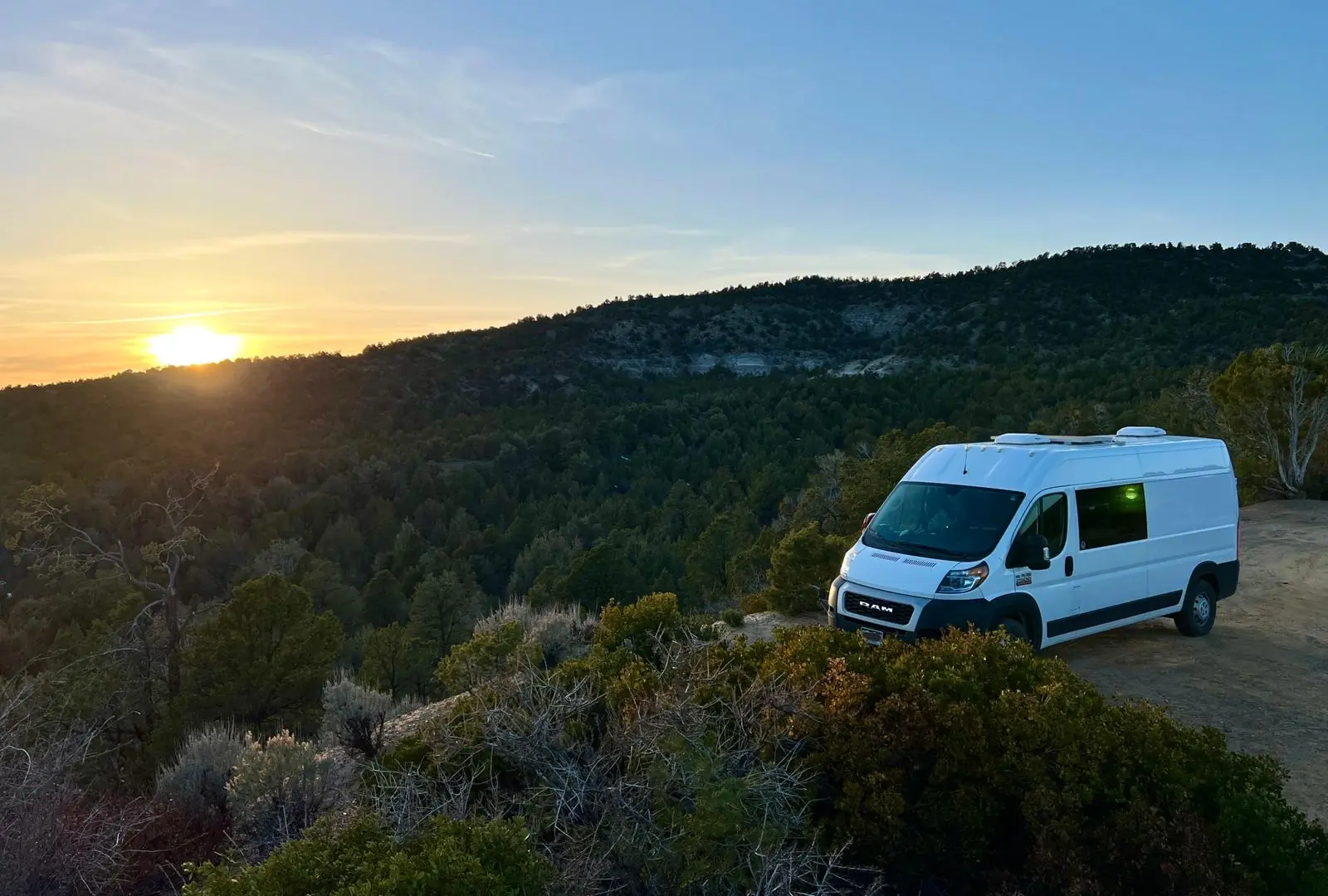 sunset at campsite; how to live in a van life tips ideas