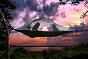 people in tentsile stingray at sunset