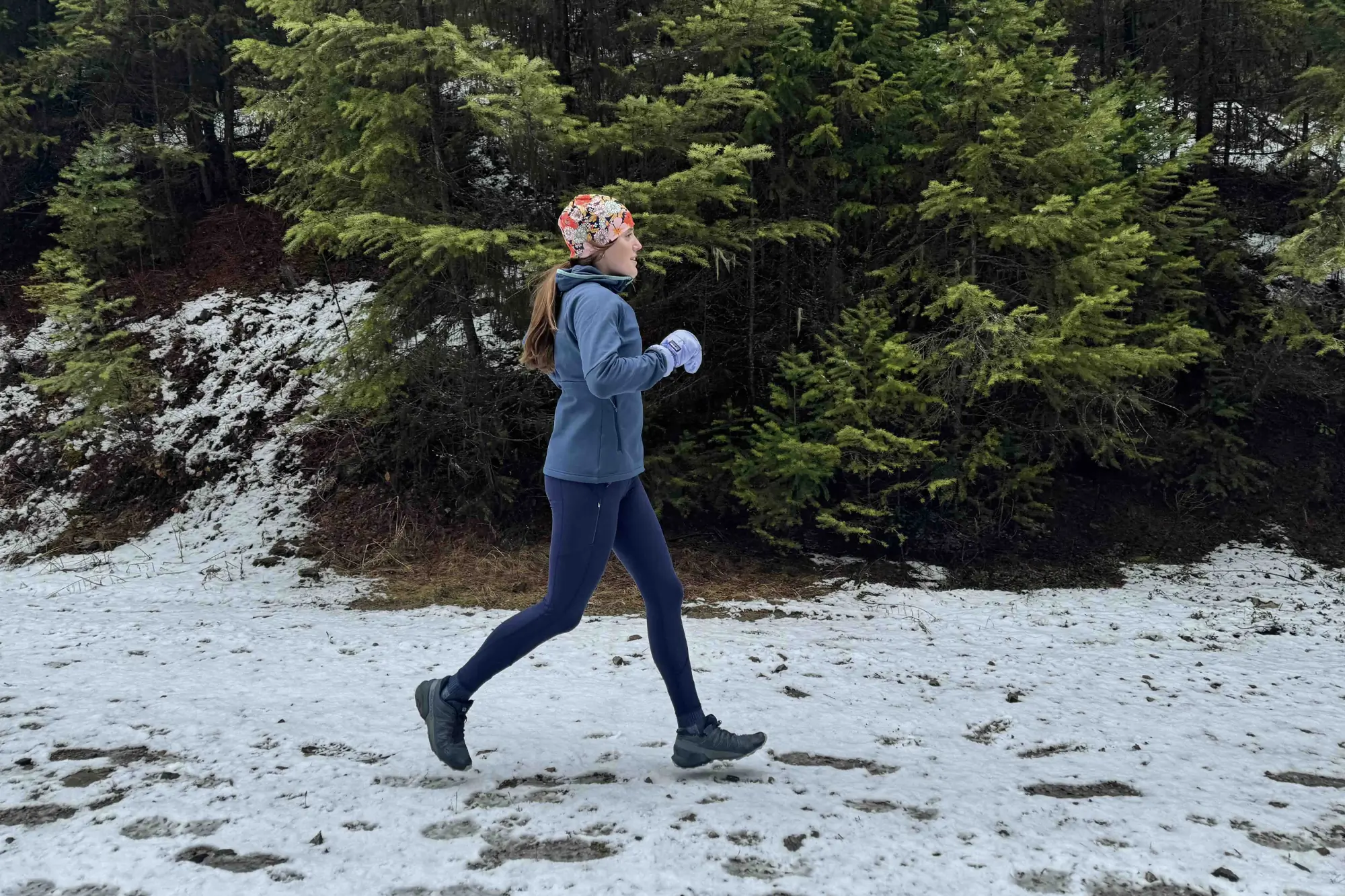 woman running in the rei co-op flash hyperstretch fleece jacket