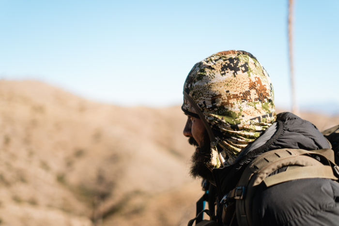 man wearing ambient 100 jacket with hood on