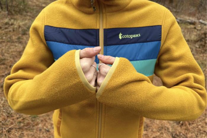 woman wearing cotopaxi teca fleece full-zip jacket
