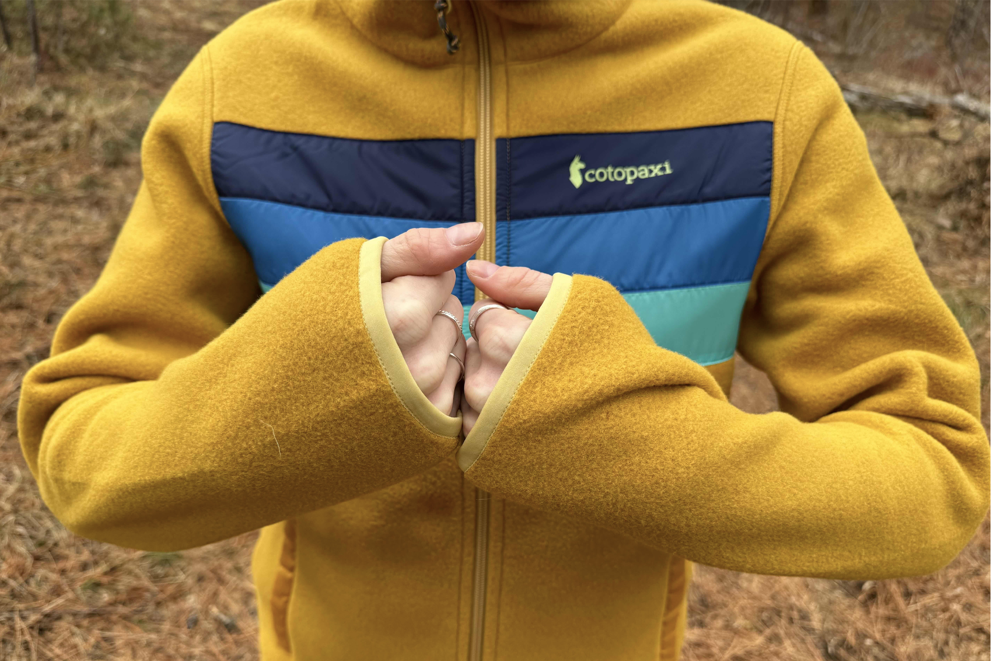 woman wearing cotopaxi teca fleece full-zip jacket