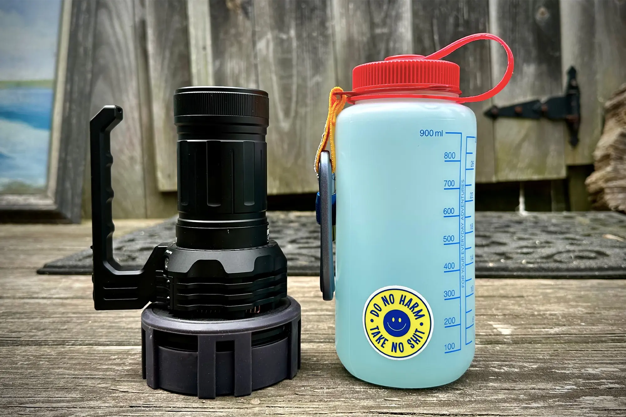 Acebeam x75 flashlight and Nalgene bottle