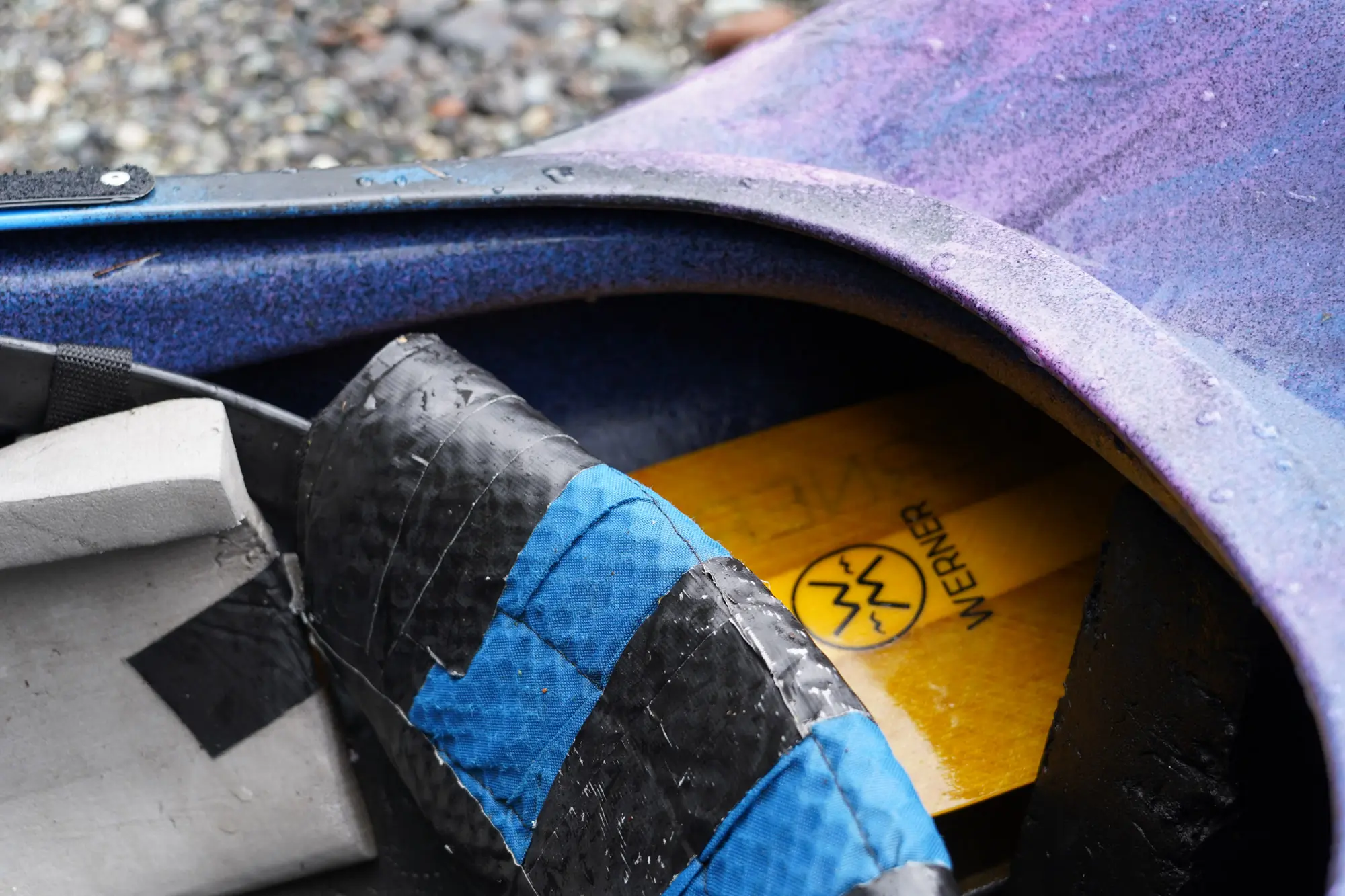 The Werner Sherpa paddle nestled into the stern of a kayak
