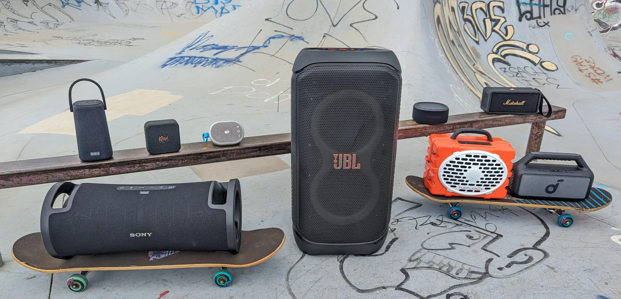 Gear Junkie - Best Portable Bluetooth Speaker - Group shot of featured speakers at a skatepark
