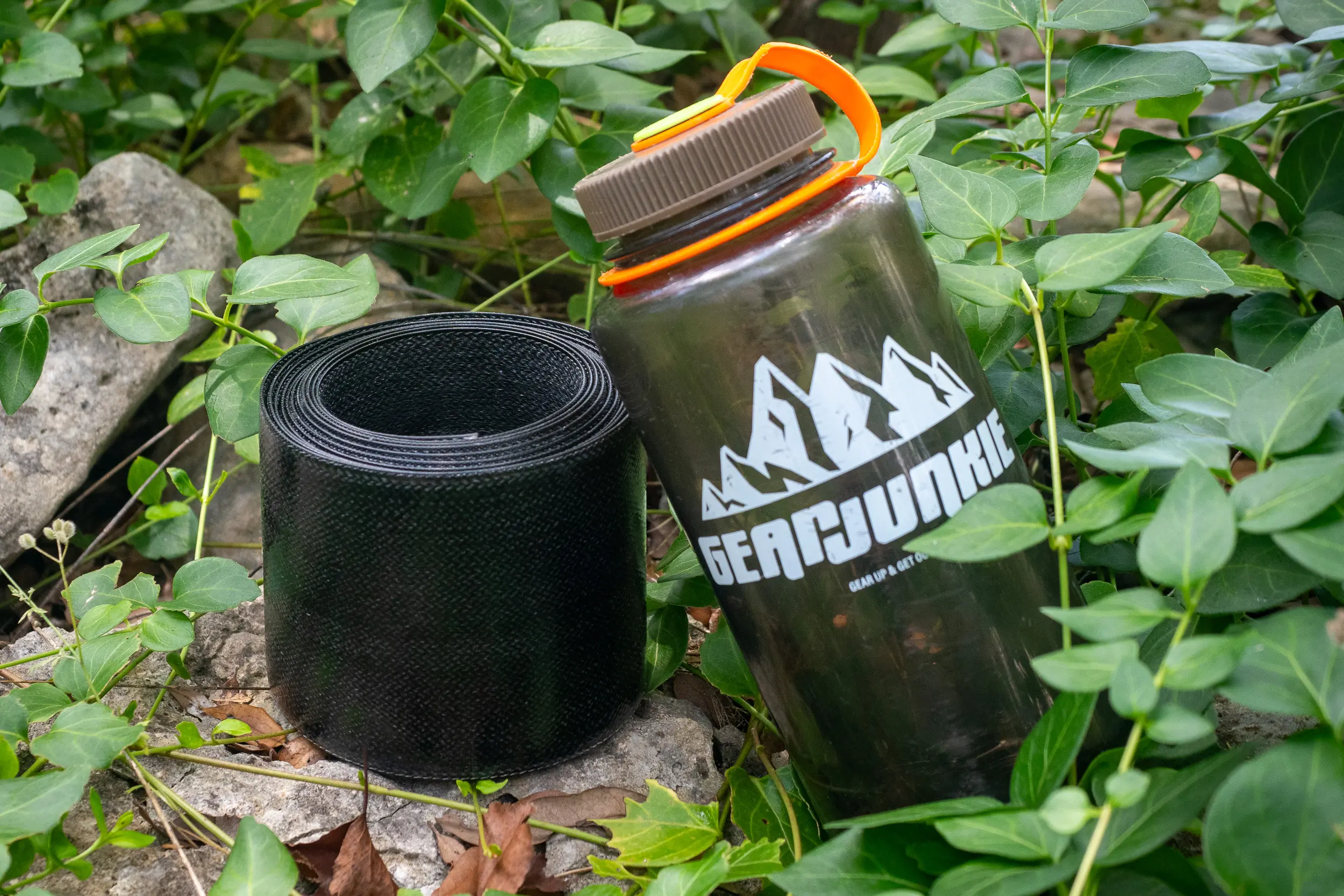 Stored Metolius Roll Up Stick Clip pole next to water bottle