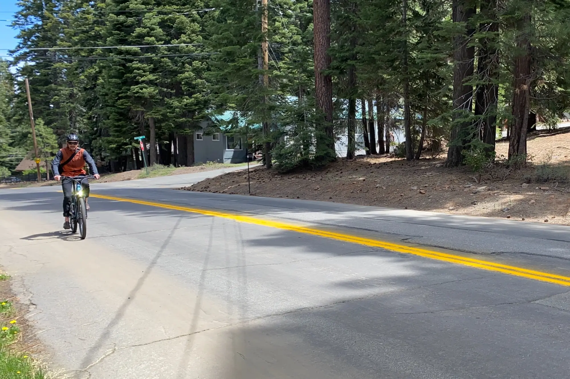 riding a commuter bike in the daytime with lights on for safety