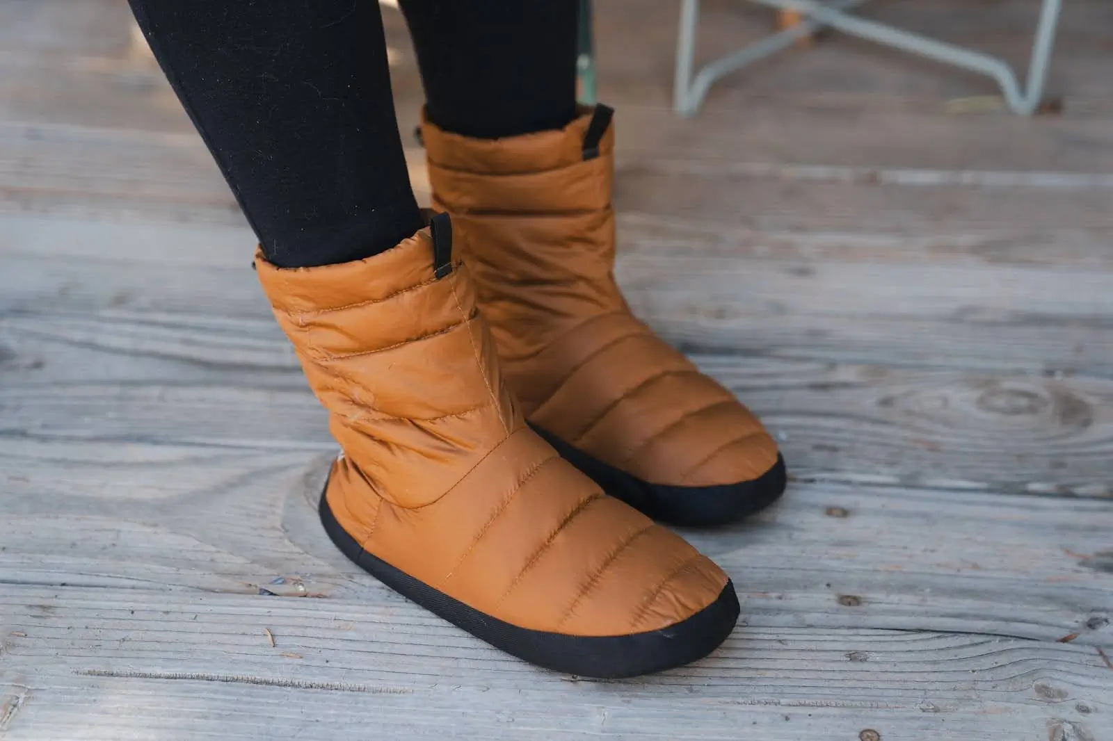 woman in black leggings wearing dijon sierra designs down booties