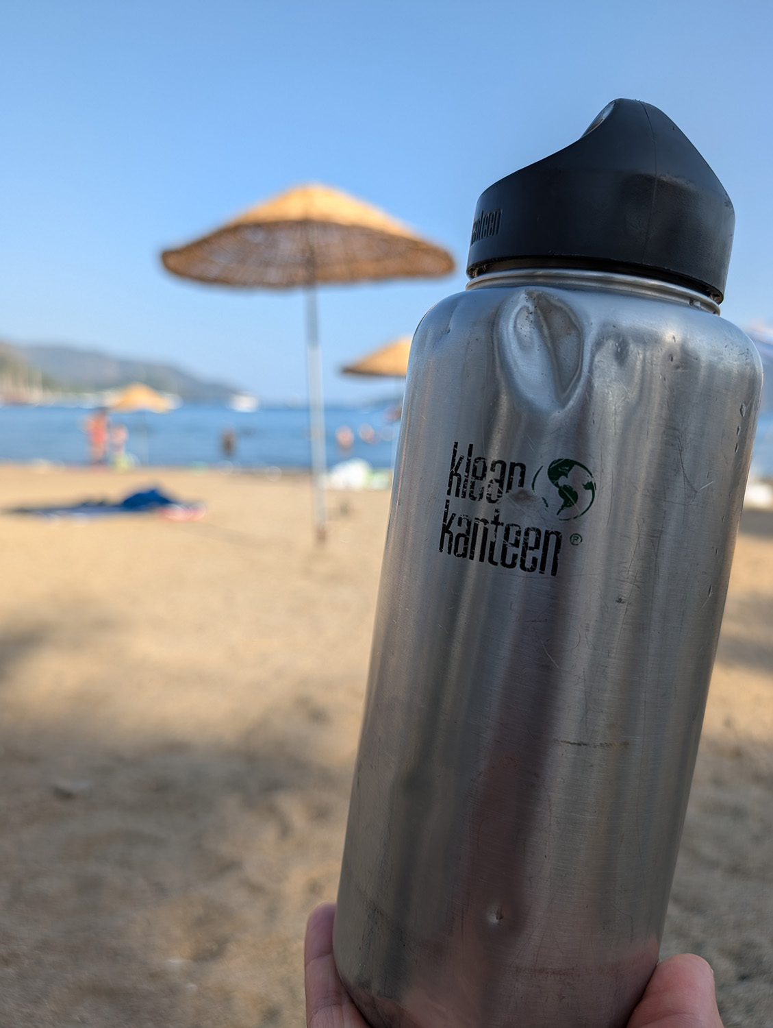 klean kanteen water bottle on beach