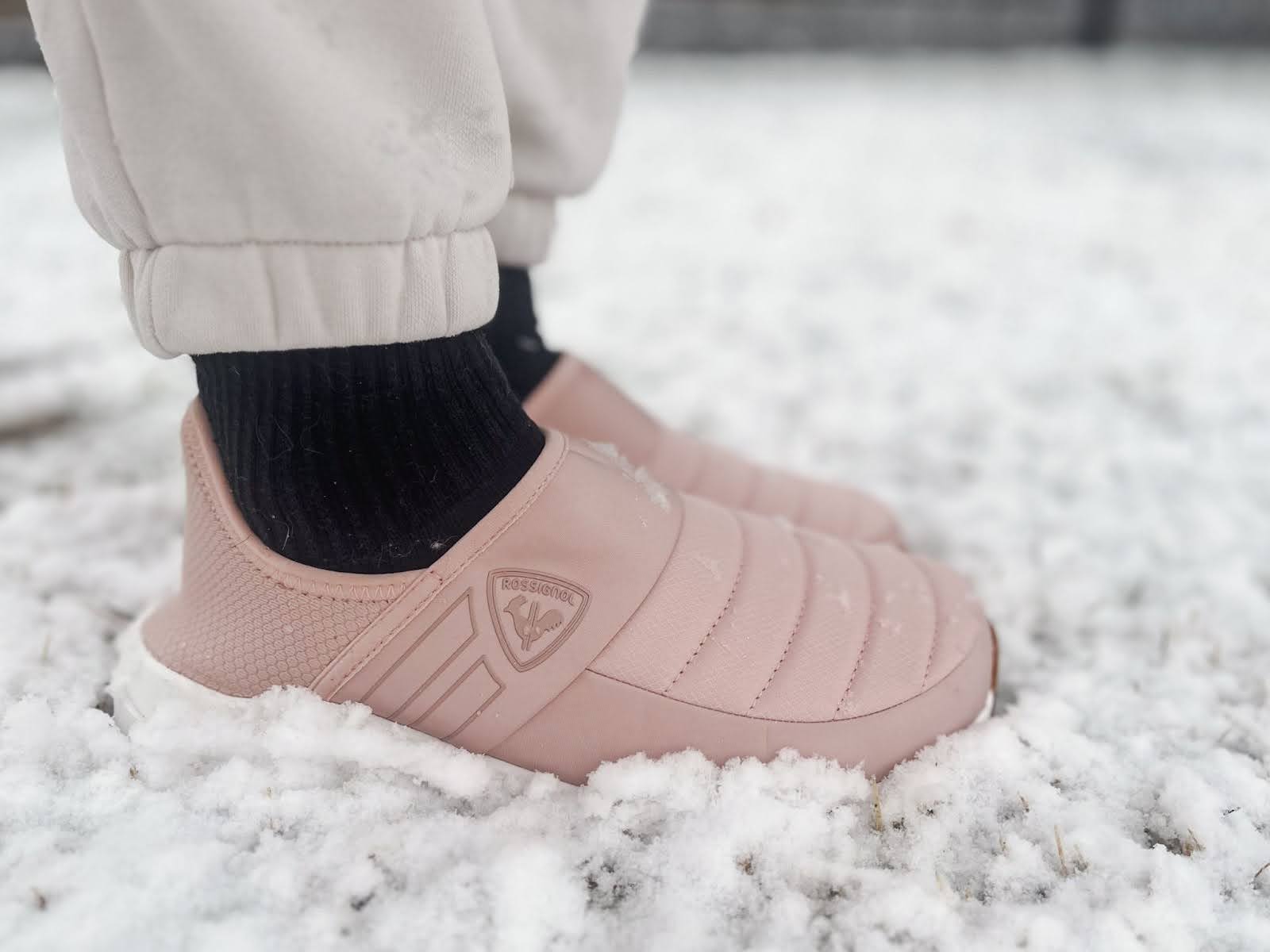 pink rossignol chalet shoes in snow