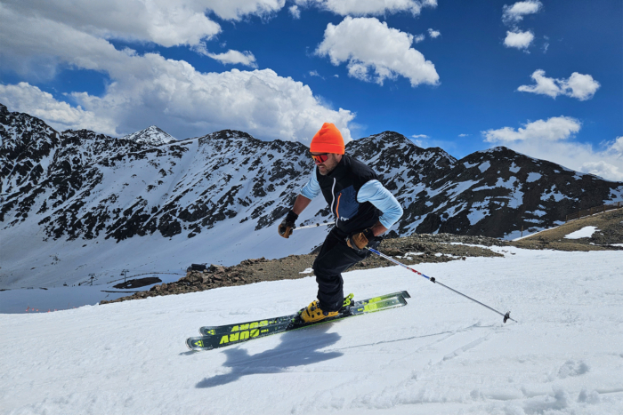 a man skiing down a snowy mountain, wearing Fischer RC4 Pro MV BOA ski boots