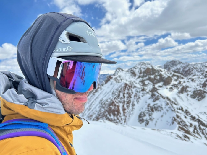 man wearing poc nexal goggles on snow