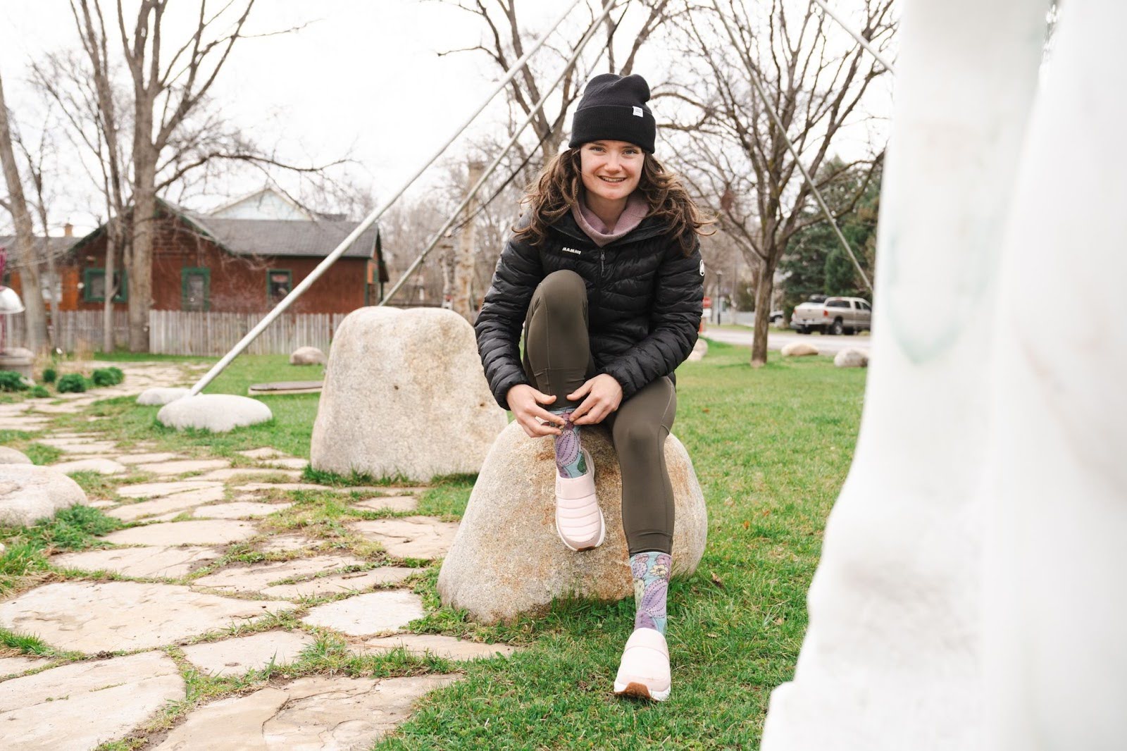 woman putting rossignol chalet shoe on