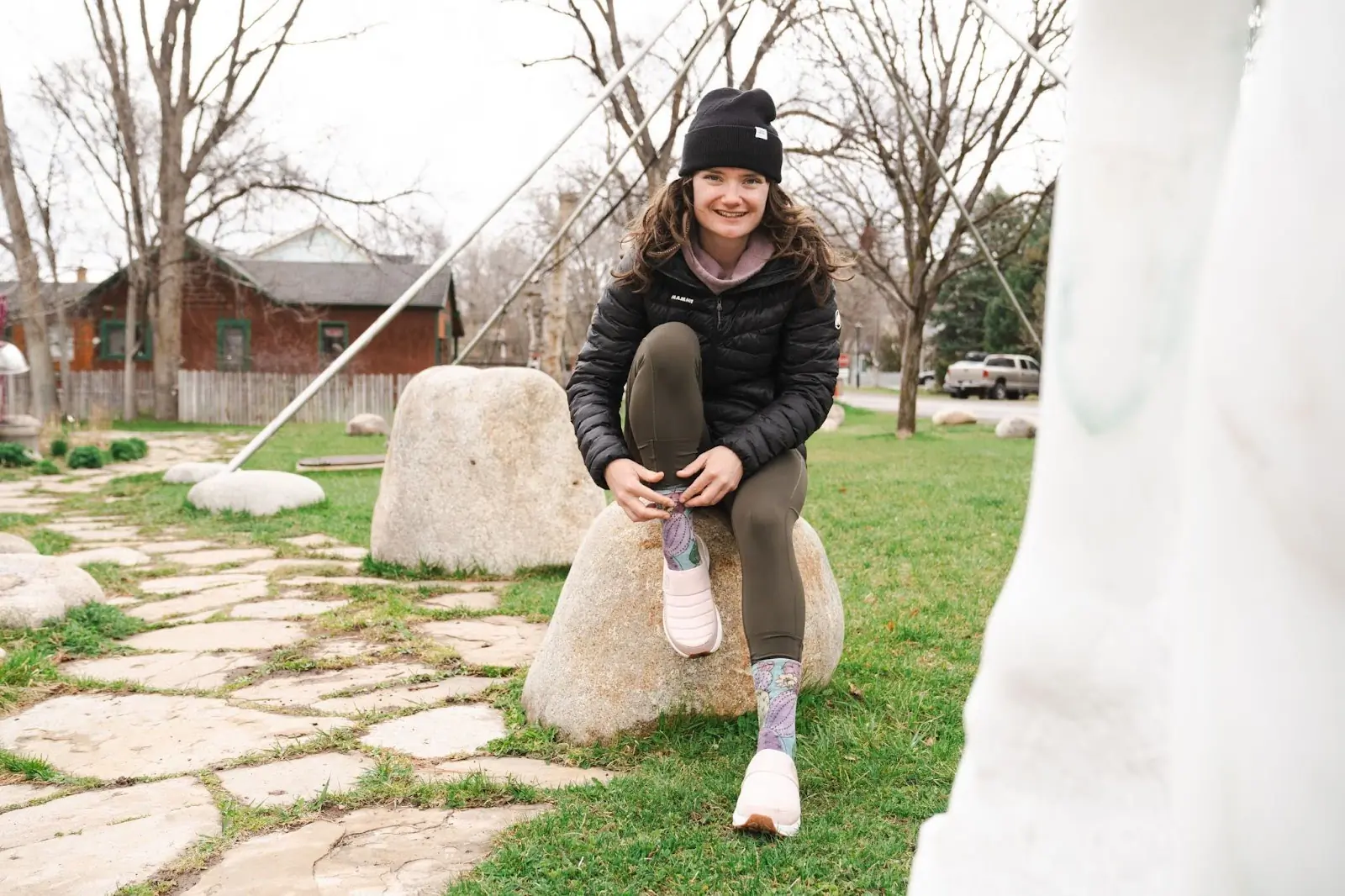 woman putting rossignol chalet shoe on