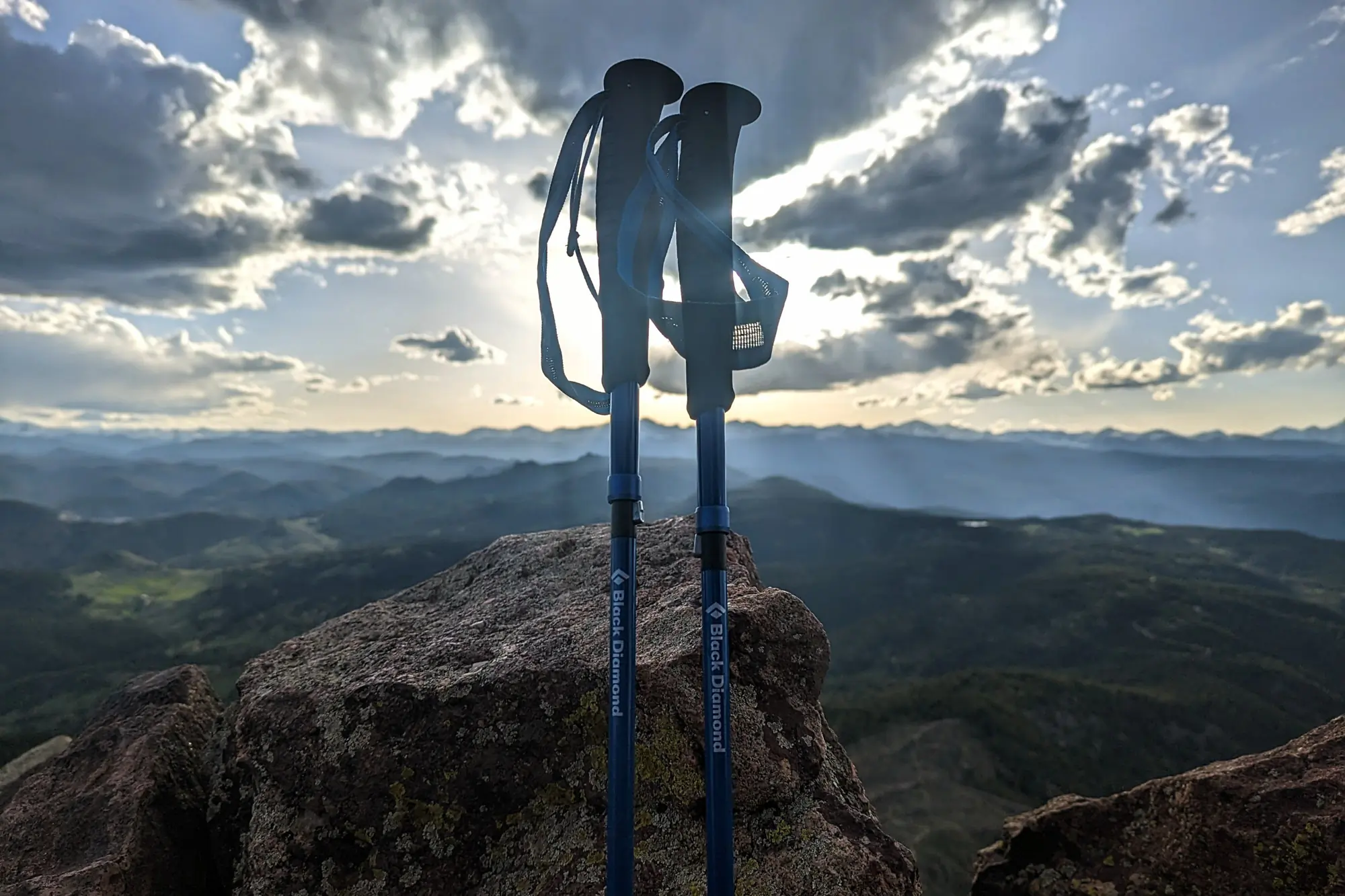 the distance carbon z poles backlit by a colorado sunset