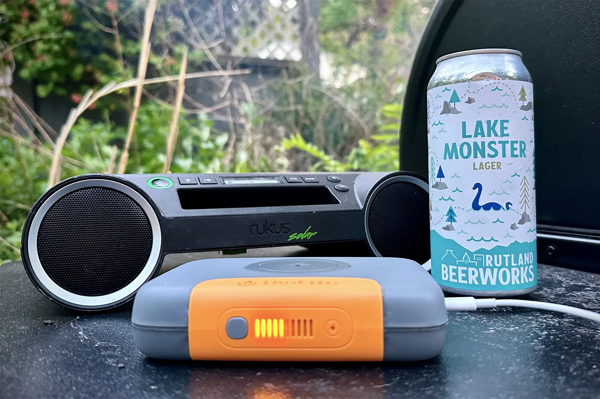BioLiite Charge 100 Max power bank next to lake monster lager and radio