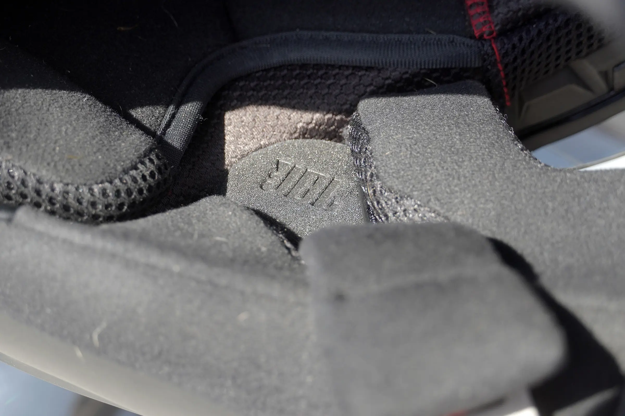 close up of the jbl signt on the Cardo Packtalk Pro