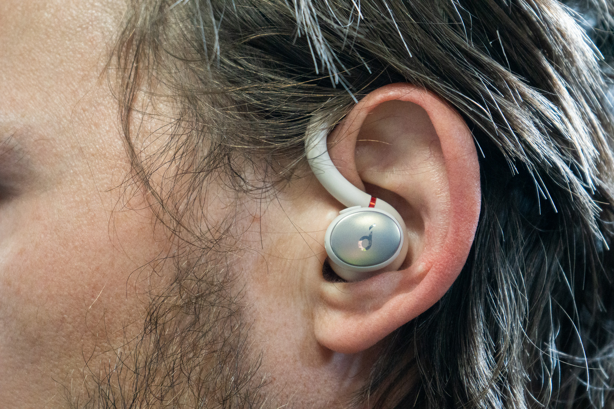 a close shot of the anker sport x10 in the author's ear