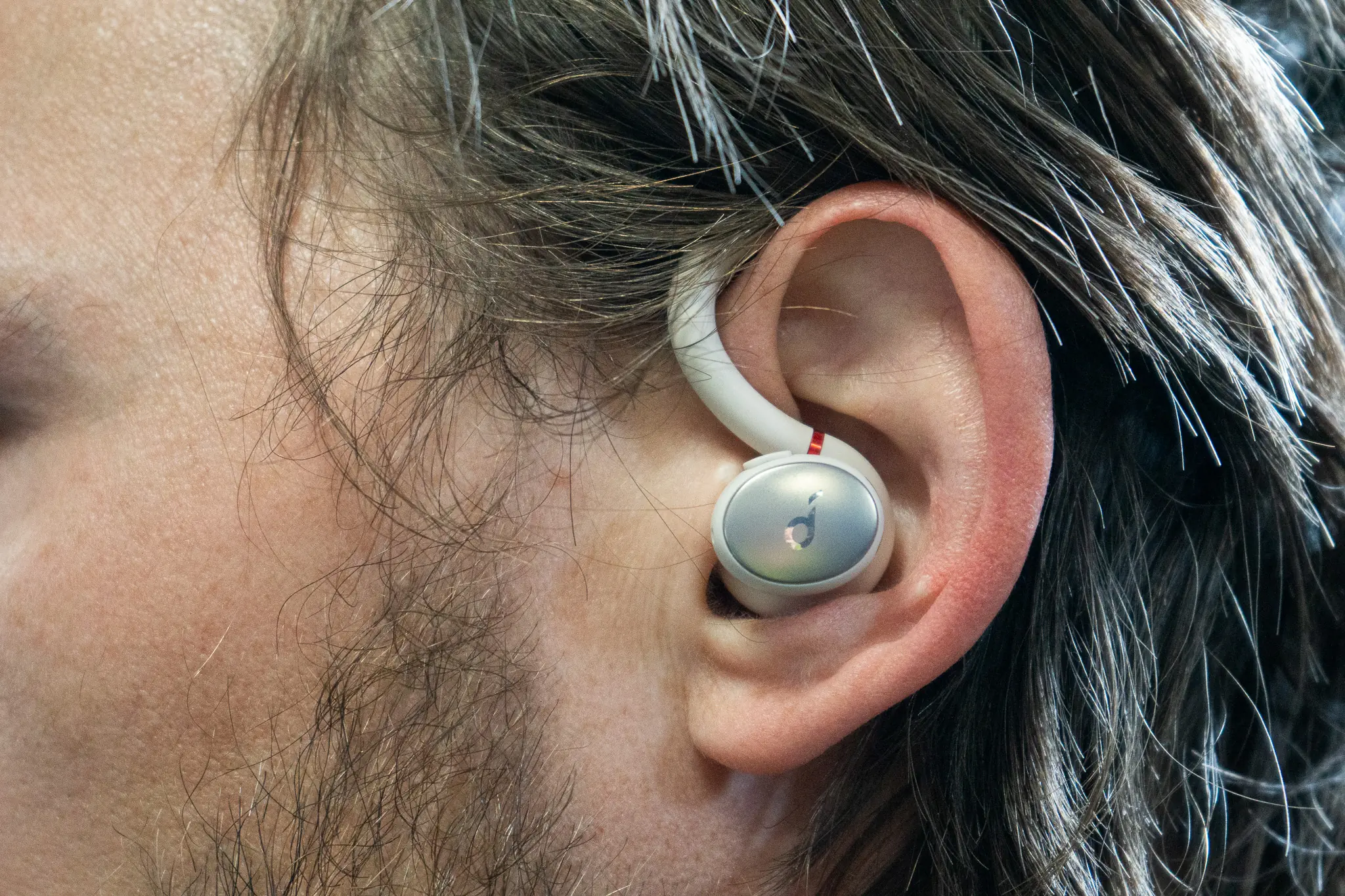 a close shot of the anker sport x10 in the author's ear