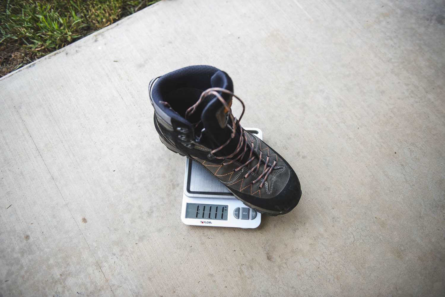 Kenetrek hiking boot being weighed on a digital scale