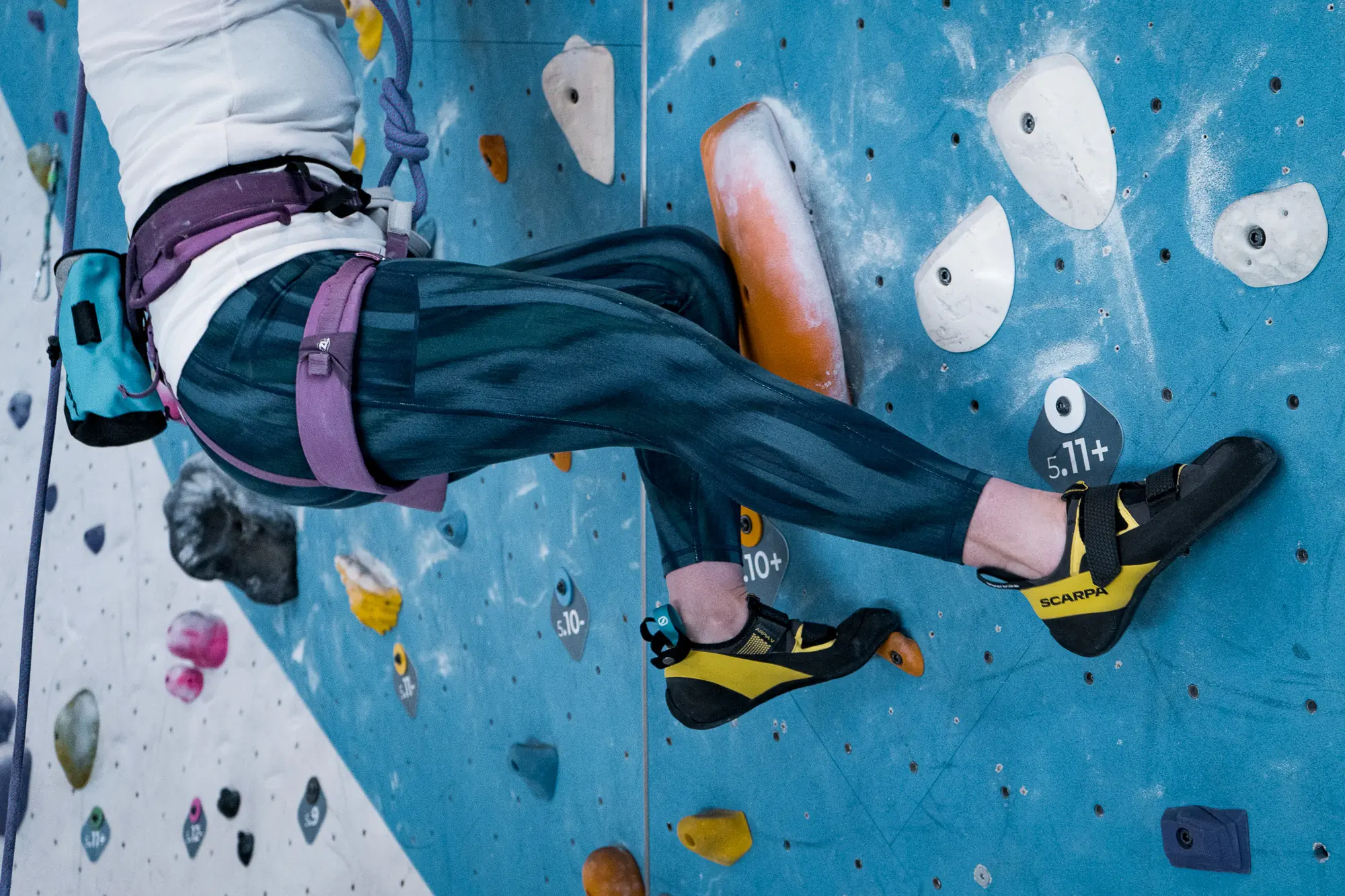 The Scarpa Arpia V climbing in a gym