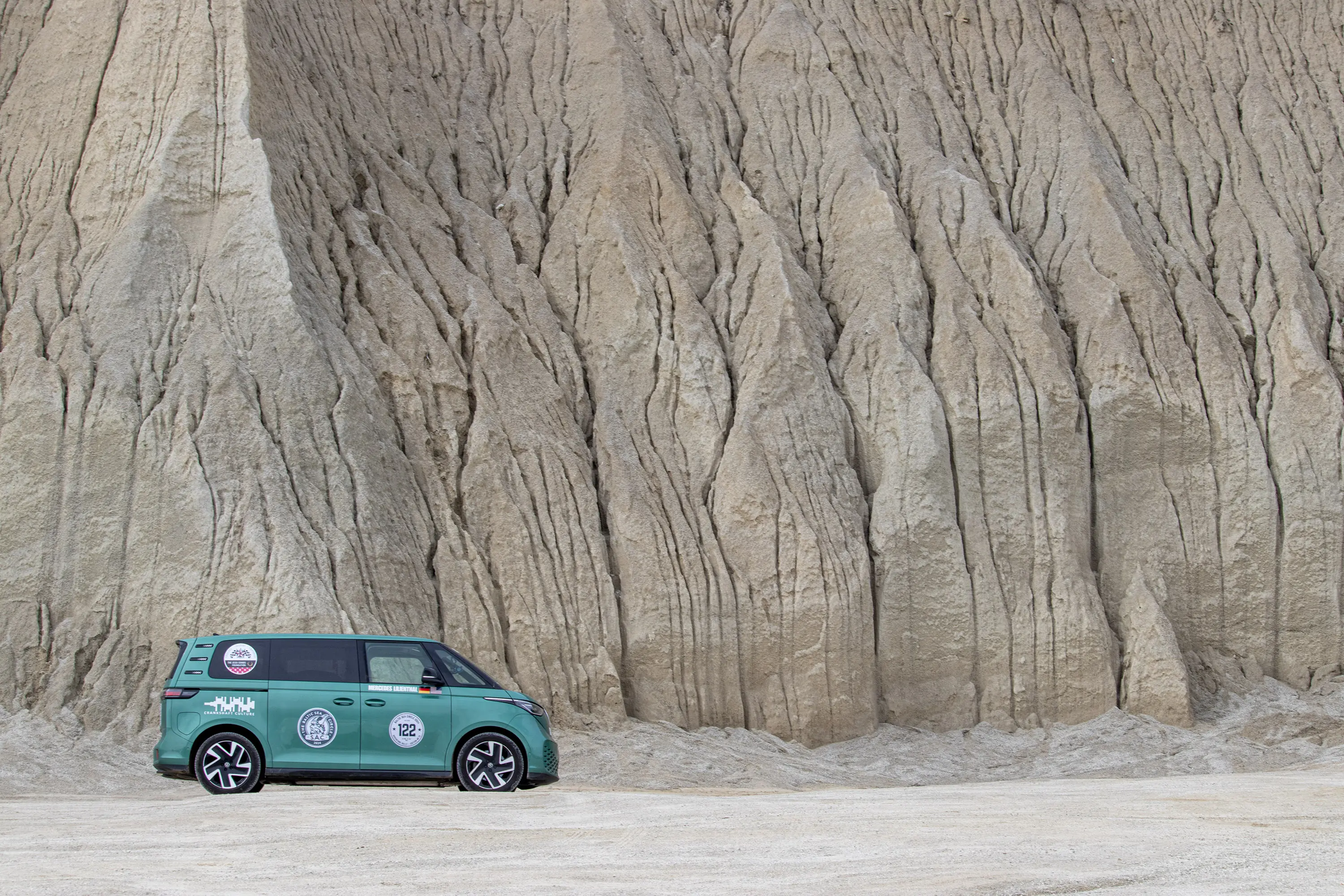 VW ID. Buzz in front of sand wall