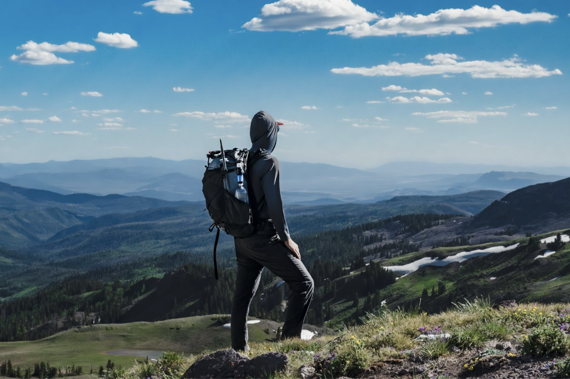 a hiker looks into the distance wearing the ultra circuit pack