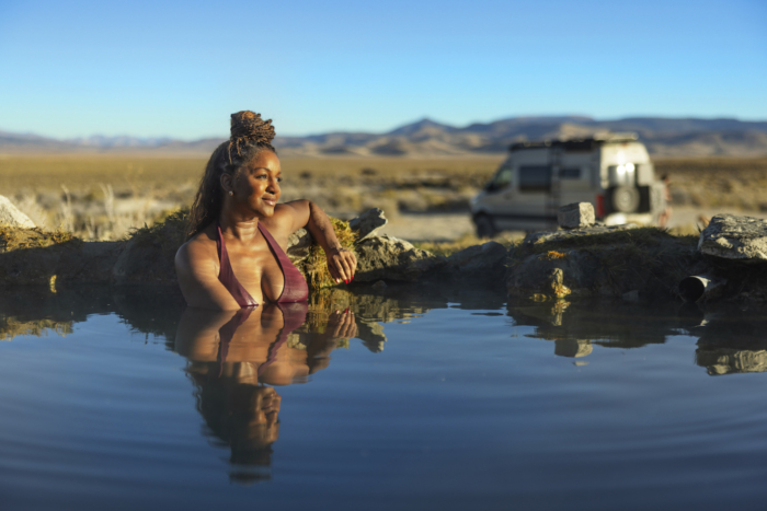 A "super soaker" enjoys the sunrise in one of the hot pools at Spencer Hot Springs. (Photo/Travel Nevada)