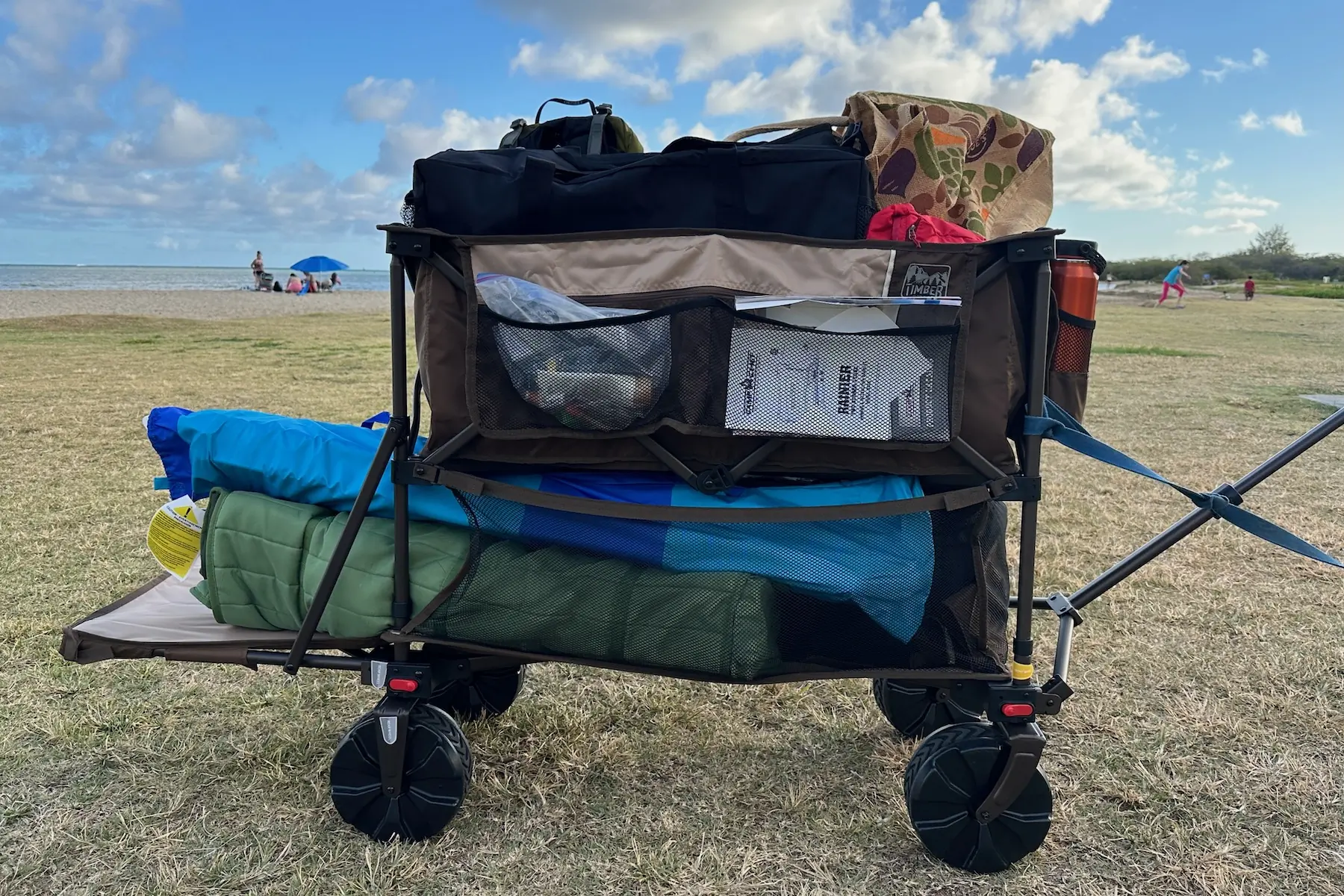 The Timber Ridge Double Decker Wagon loaded up with lots of beach gear by the ocean in Hawaii