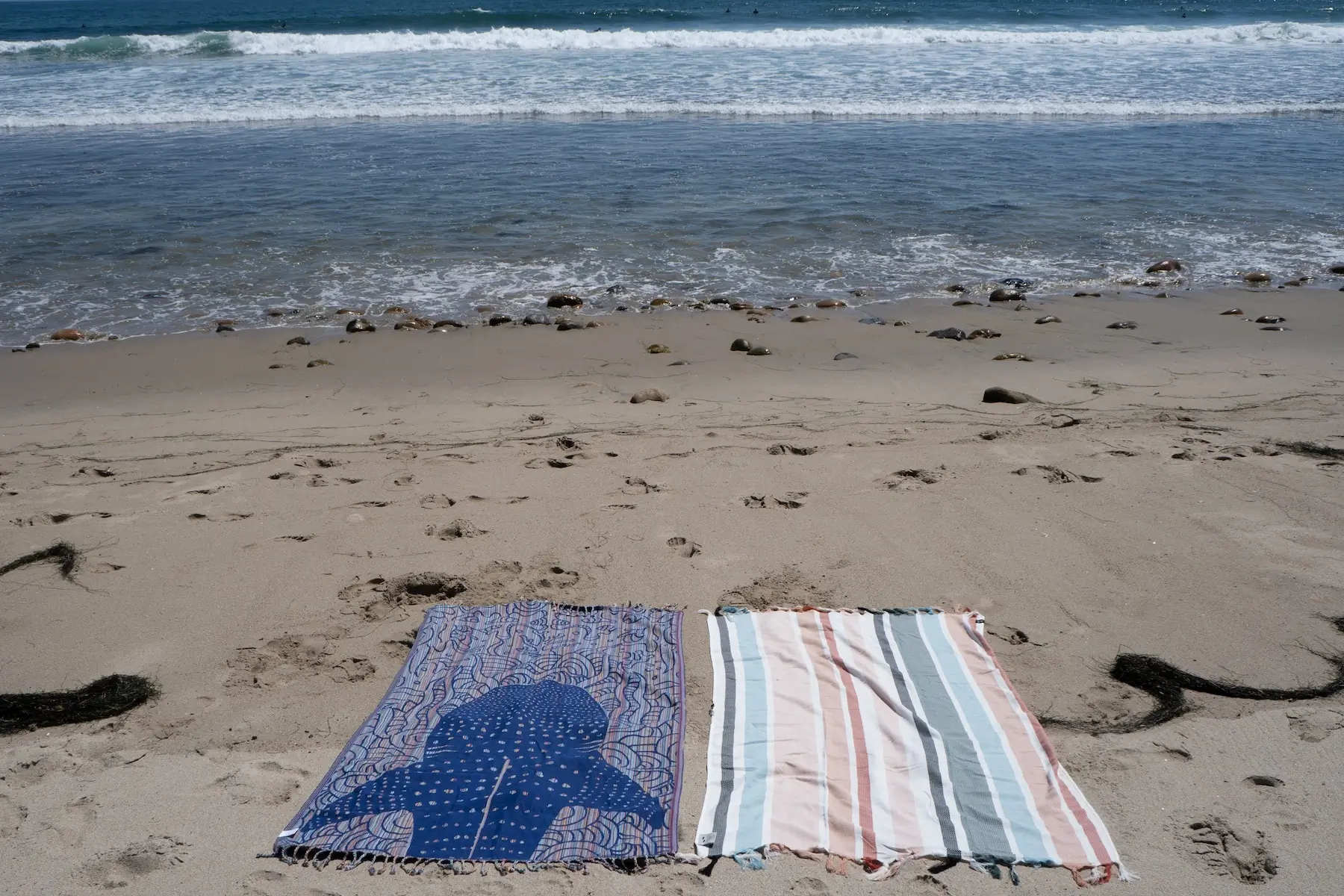 Testing the sand cloud and slowtide Turkish towels side by side on a southern california beach