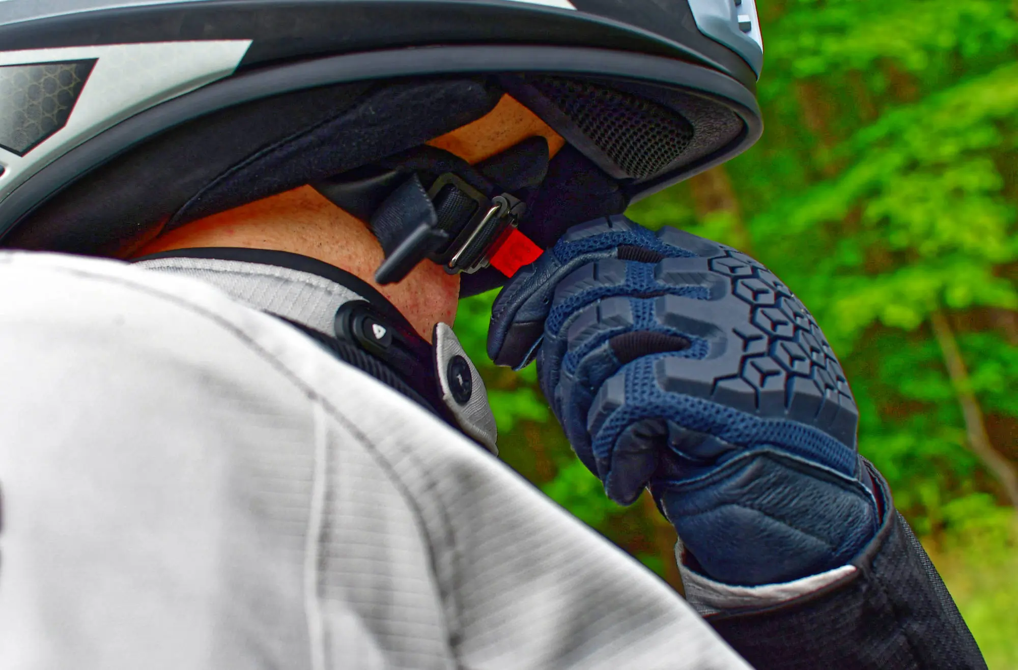 adjusting helmet while wearing rev’it! sand 4 gloves