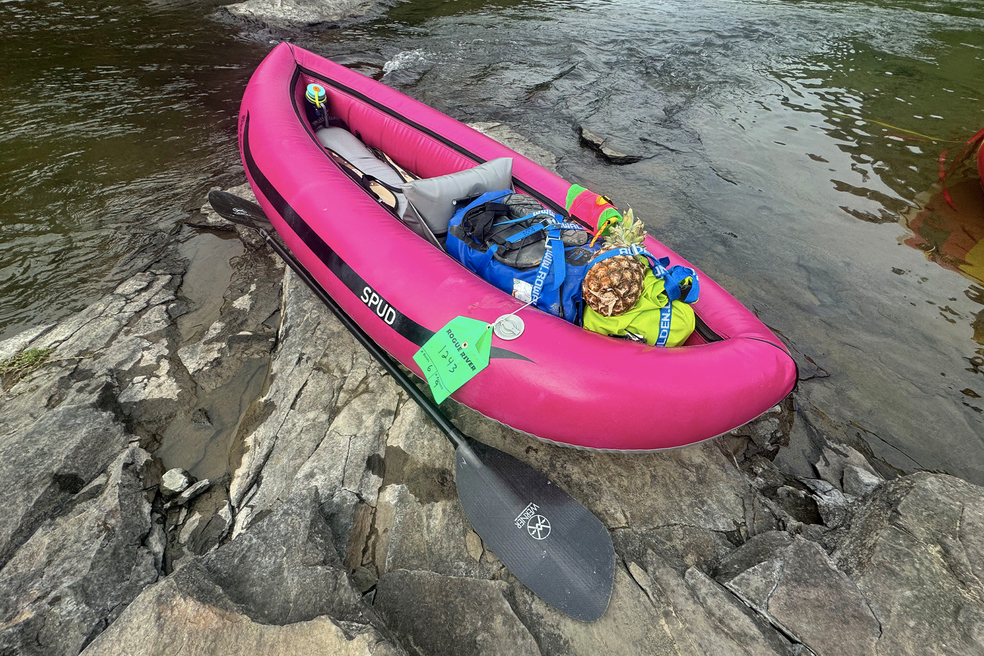 pink aire tributary spud inflatable kayak packed for camping