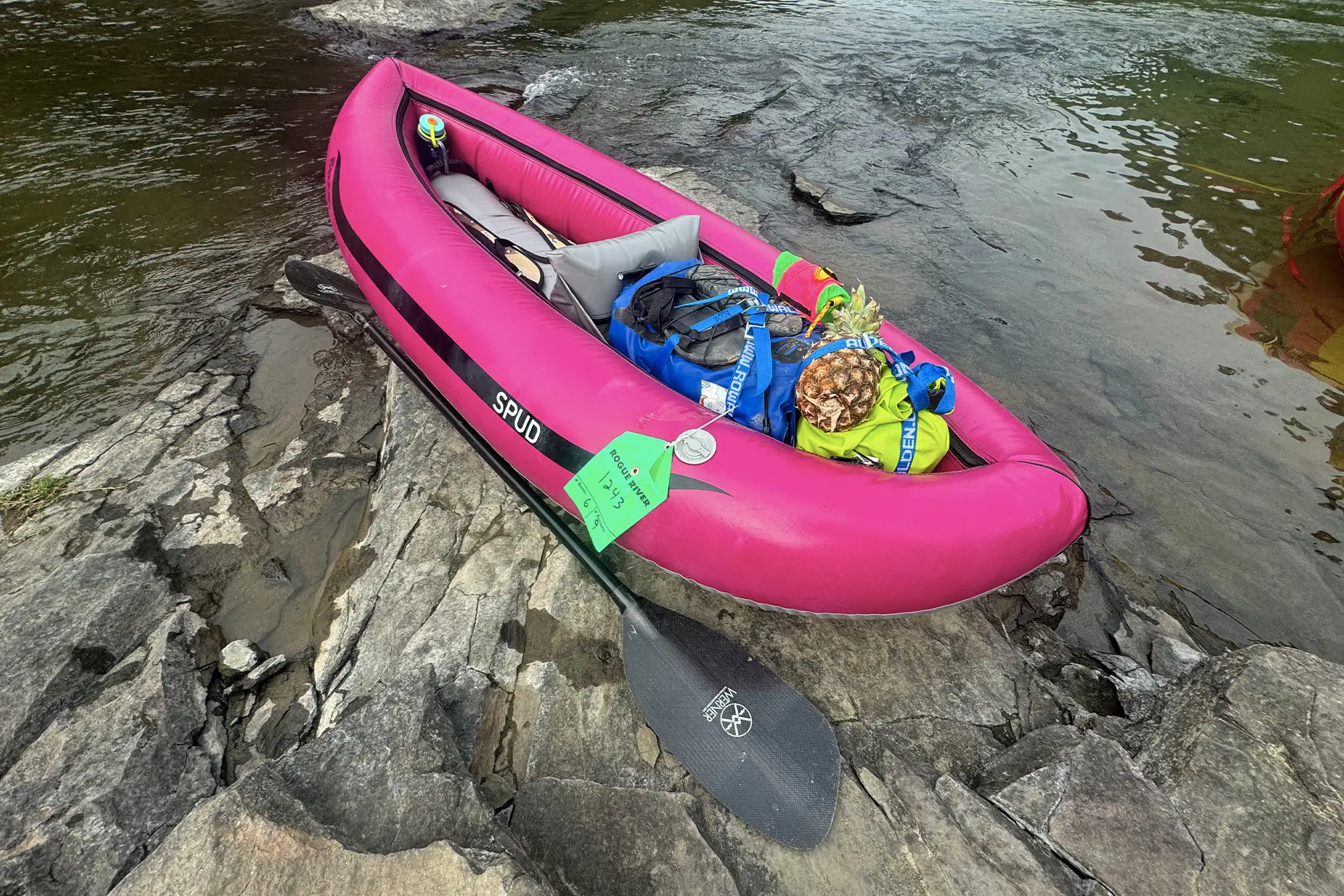 pink aire tributary spud inflatable kayak packed for camping