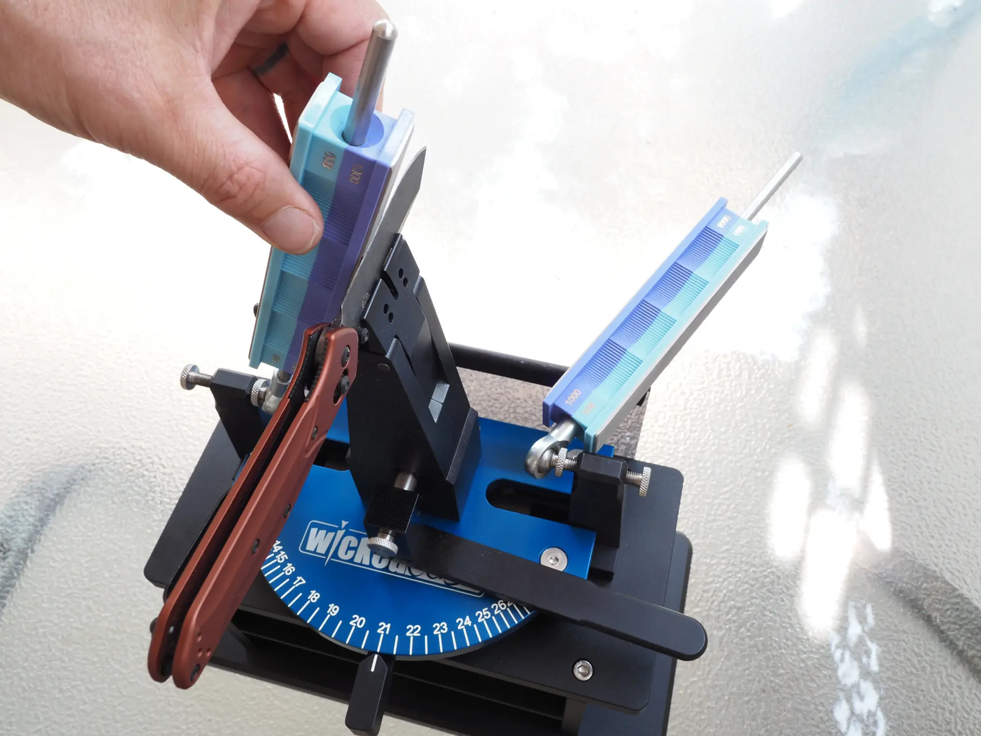 Benchmade Osborne knife in Wicked Edge sharpener