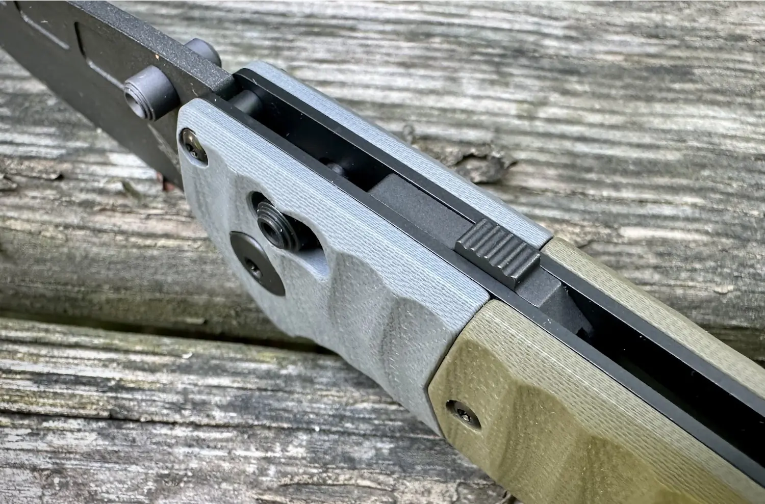 Close-up view of Benchmade PSK knife showing the locking mechanism and textured handle