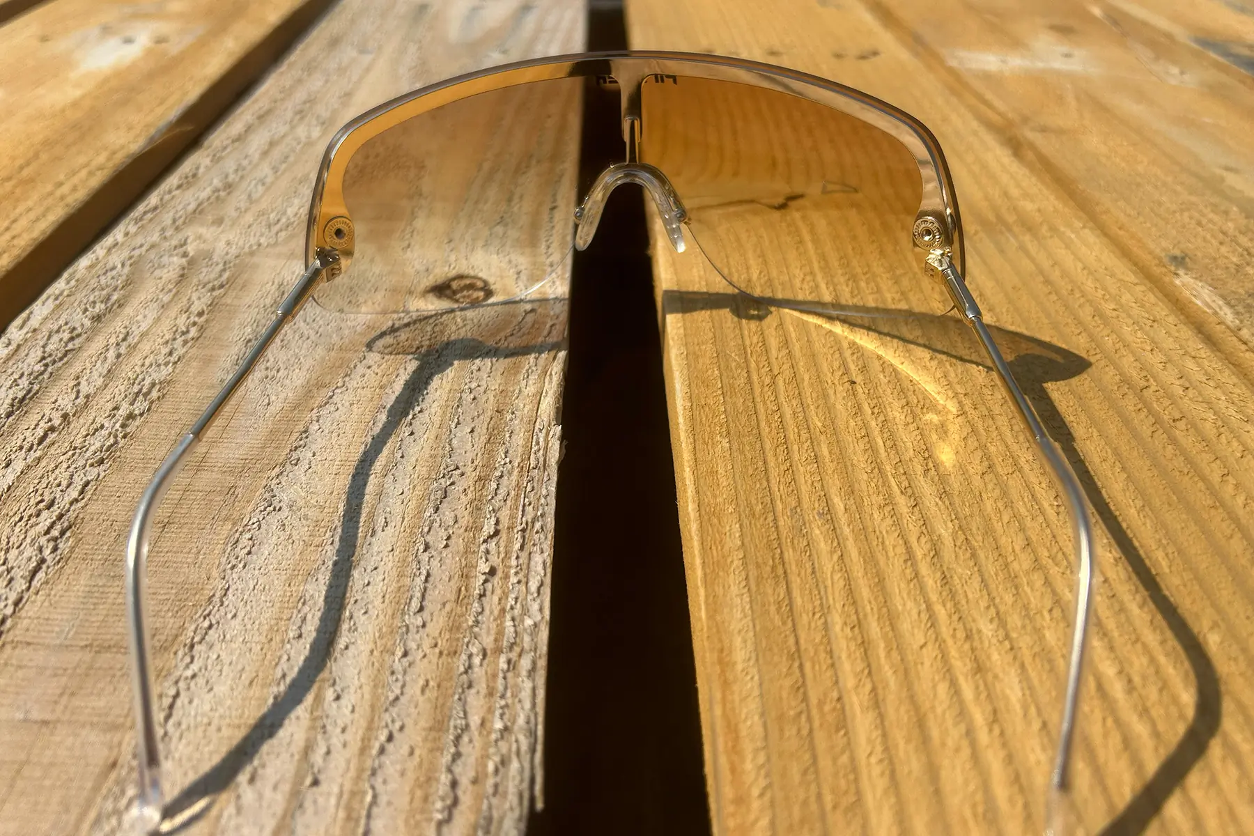 pit viper limousine gold sunglasses on wood