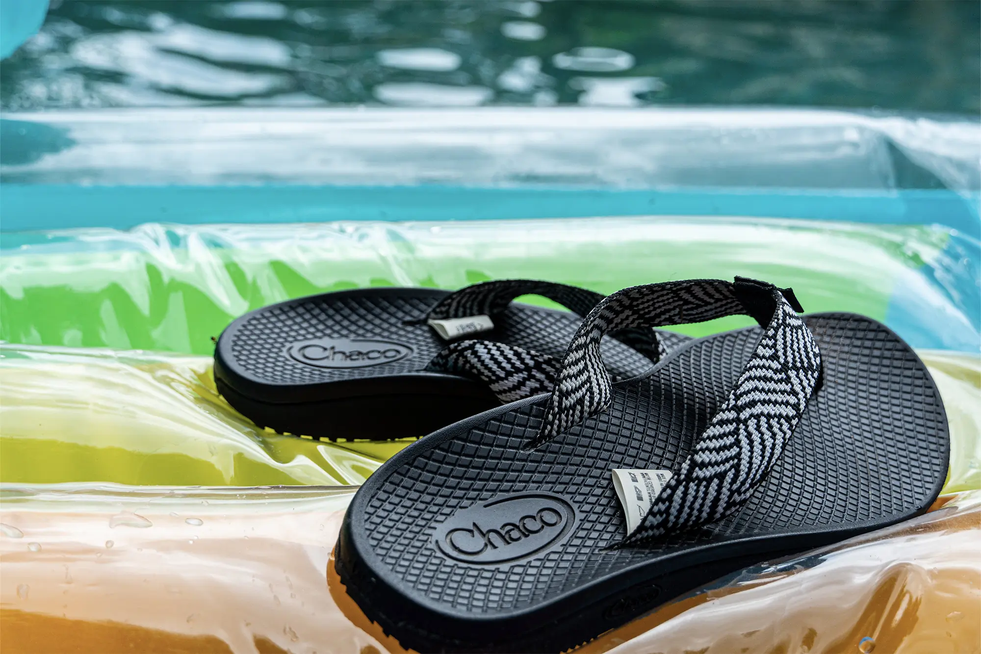 chaco flips on pool float showing tags