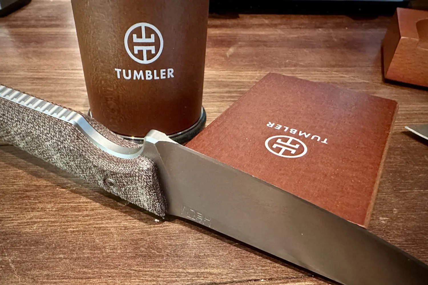 Close-up of a Tumbler sharpener set on a wooden table