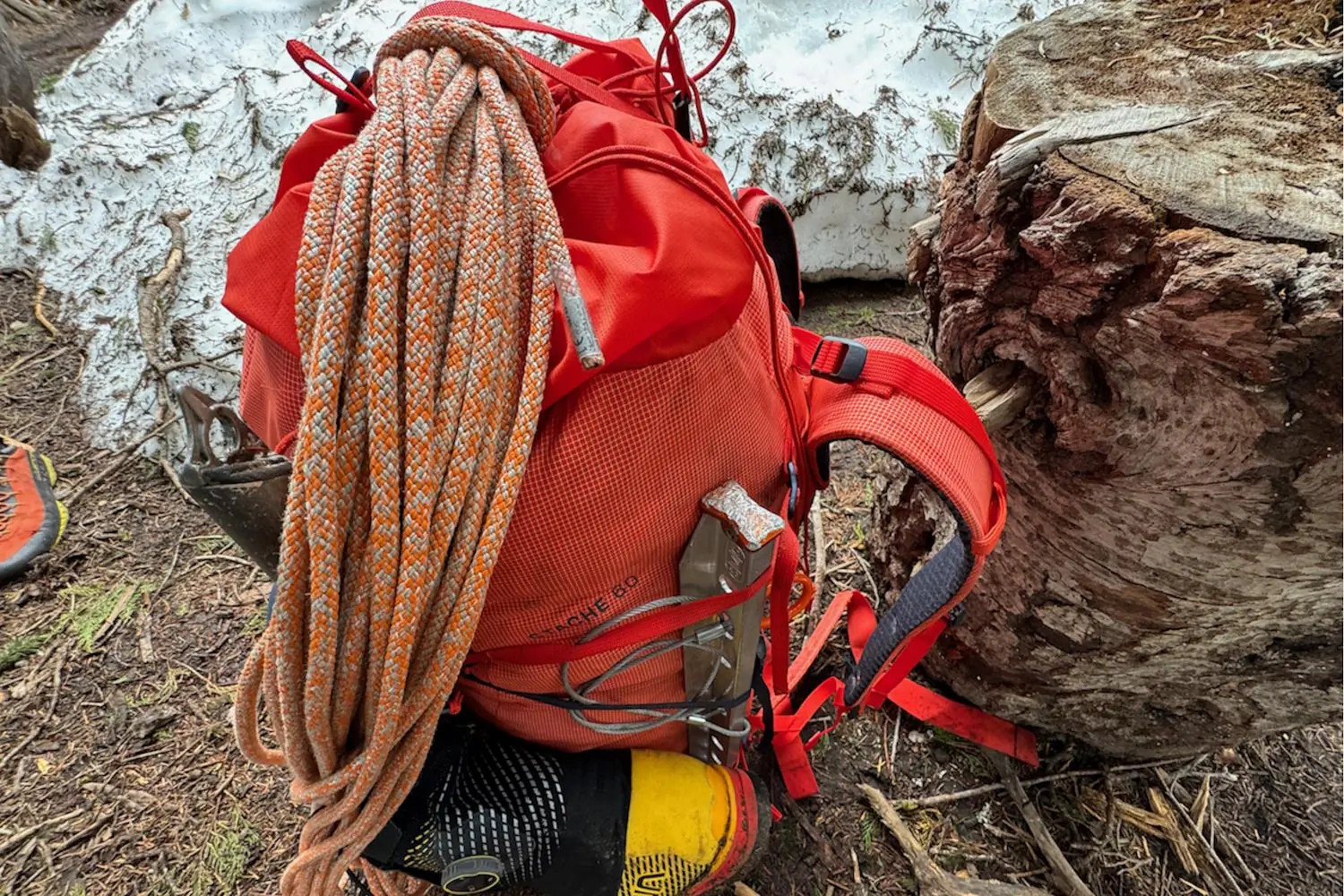 Close-up of a Blue Ice Stache 60L backpack loaded with climbing gear