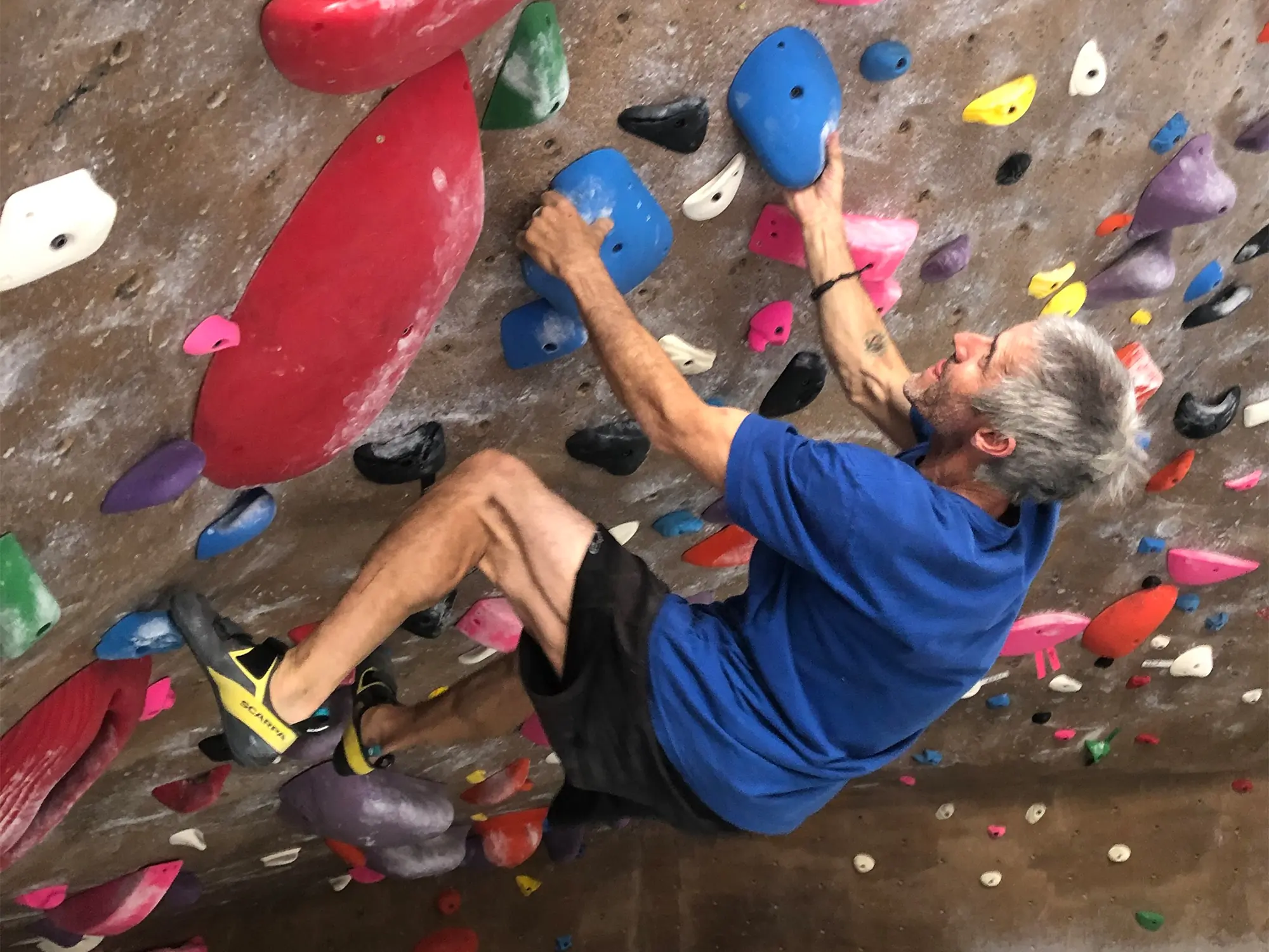 engaging on steeps at the boulder rock club wearing arpia v climbing shoes