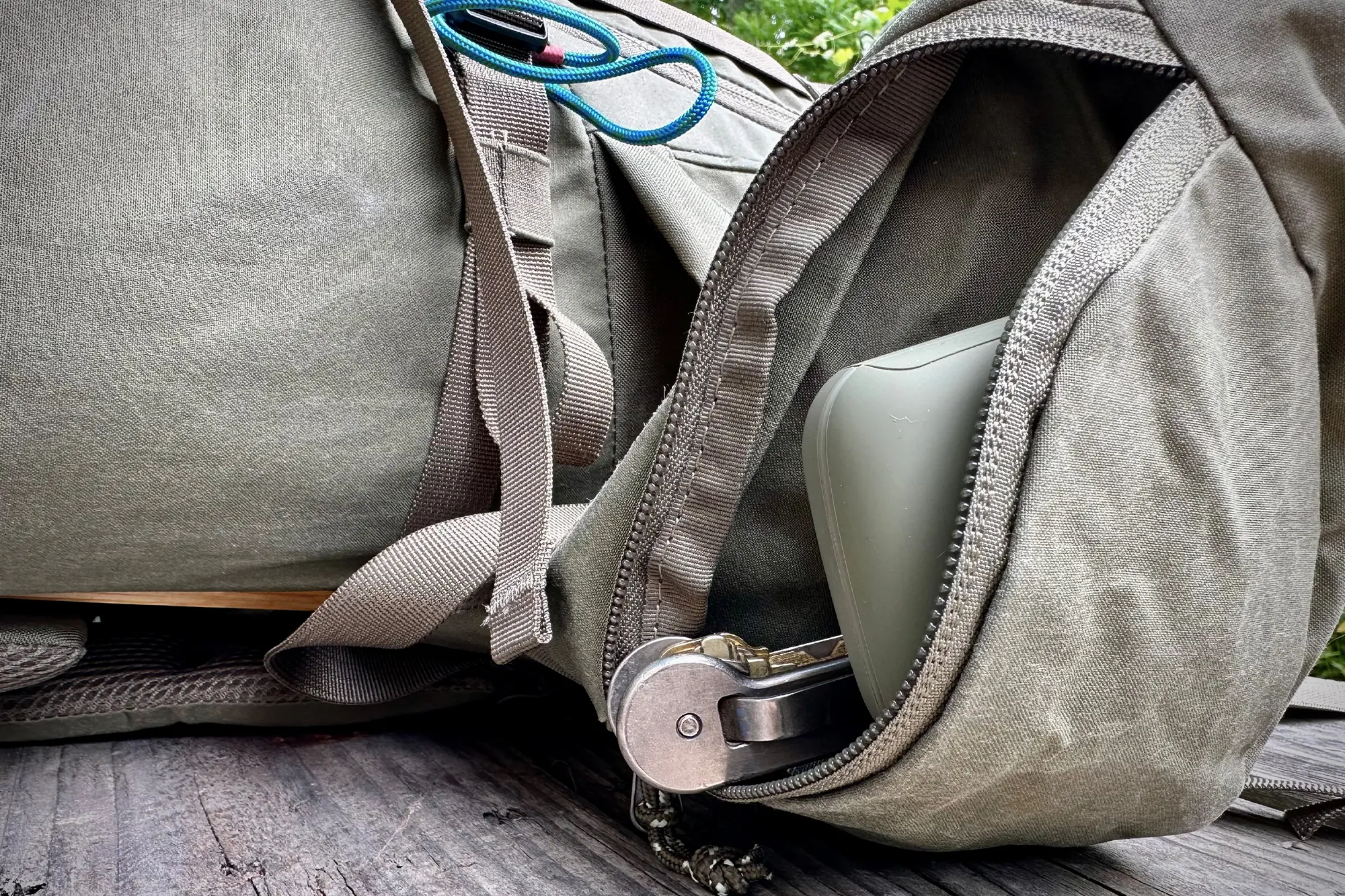 the fjallraven kajka 35 pack's belt pocket filled with items neatly tucked inside