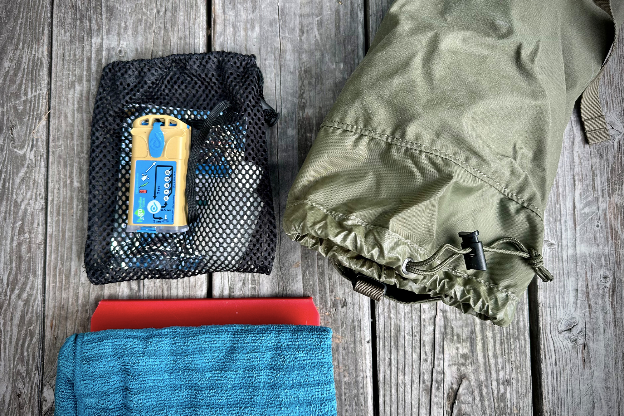 fjallraven kajka 35 side pocket shown with its contents next to it