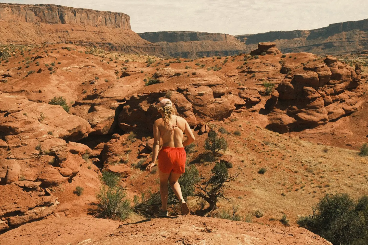 A hiker wearing Brewess 2.0 boots hiking in desert