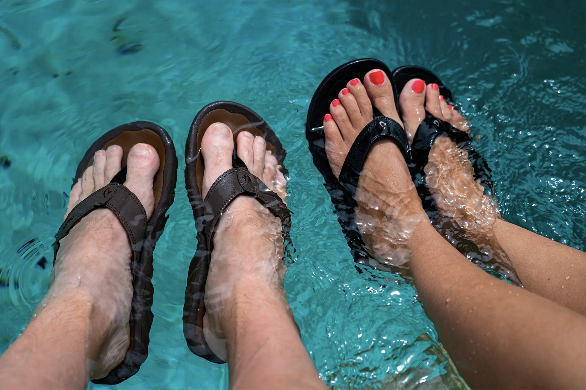 man and women olukai ohana flip flops