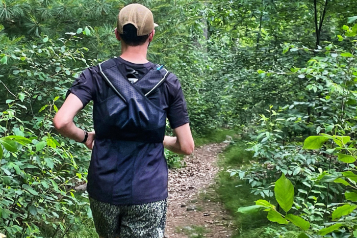 man running in Vessel hydroshirt on trail
