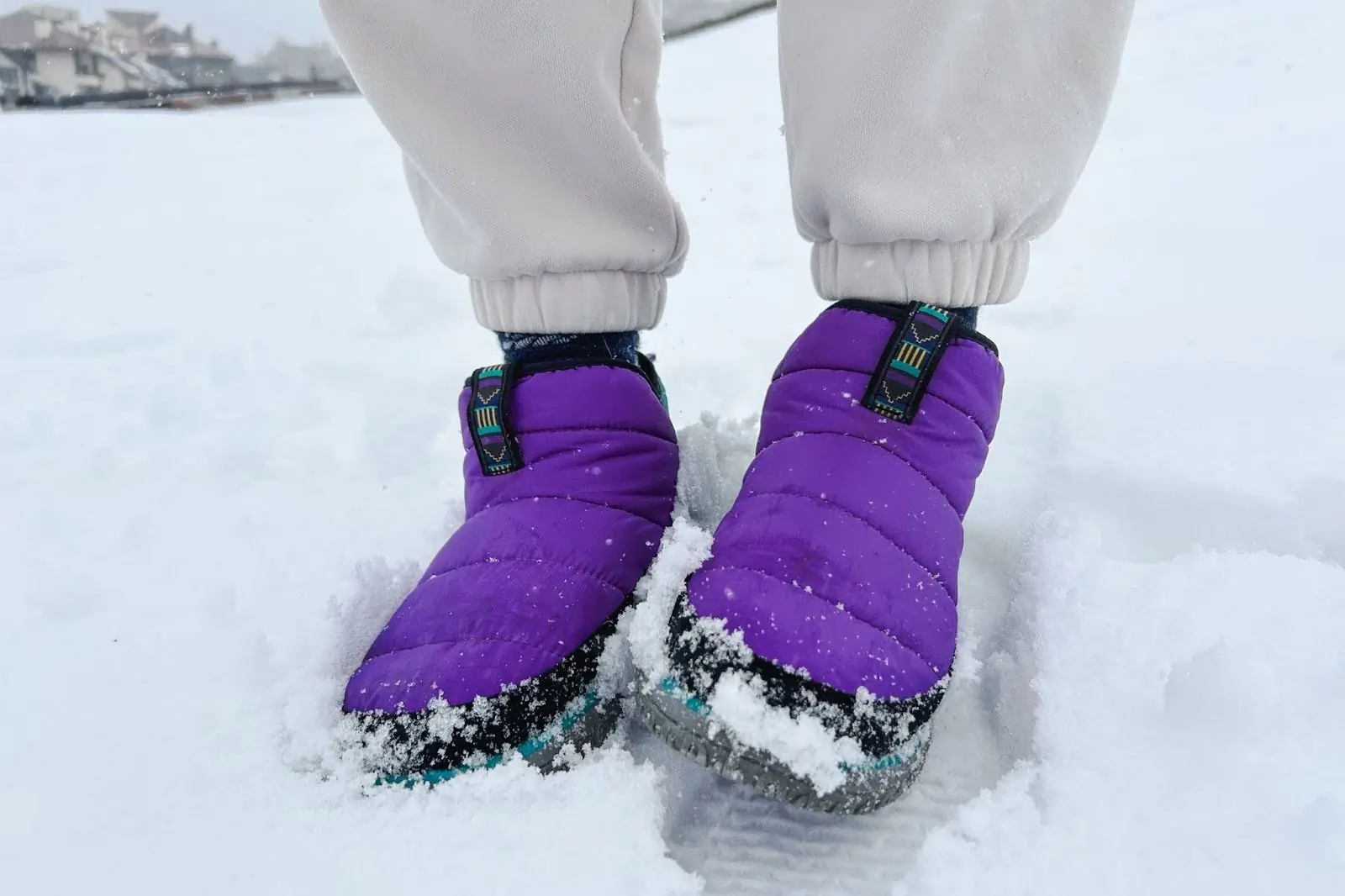 purple mountain classic booties on the snow