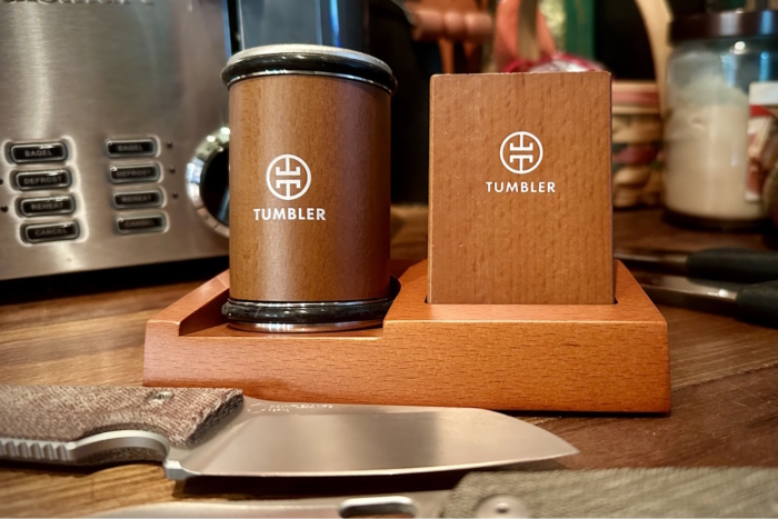 Tumbler knife sharpener set on a wooden base